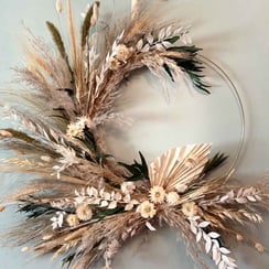 A wreath with neutral coloured dried flowers